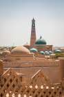 Khiva, Xorazm Region, Uzbekistan, Central Asia. Pahlavan Mahmoud Mausoleum and Islam Khoja Minaret. Art Print
